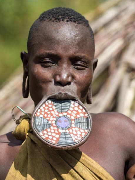 A Woman Of The Mursi Tribe Wearing A Traditional Lip Plate In A