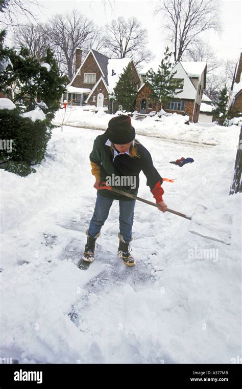 Elderly Woman Shoveling Snow Hi Res Stock Photography And Images Alamy