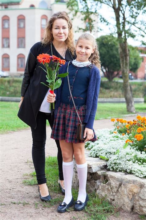 Full-length Portrait of Caucasian Mother and Daughter Going Back To ...