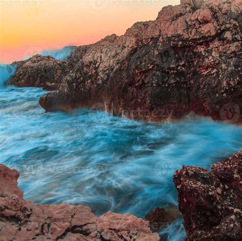 Raging Ocean Waves Breaking On Rocks At Sunset 16482487 Stock Photo At