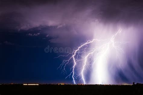 Lightning Bolt Strike From A Thunderstorm Over A City Stock Photo