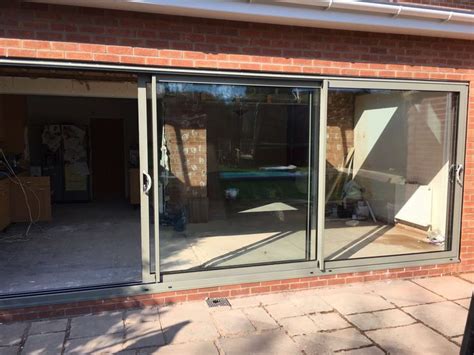 A Ral Grey Smarts Aluminium Triple Track Patio Door Installed In