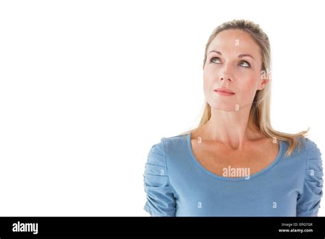 Thinking Pretty Blonde Looking Up Stock Photo Alamy