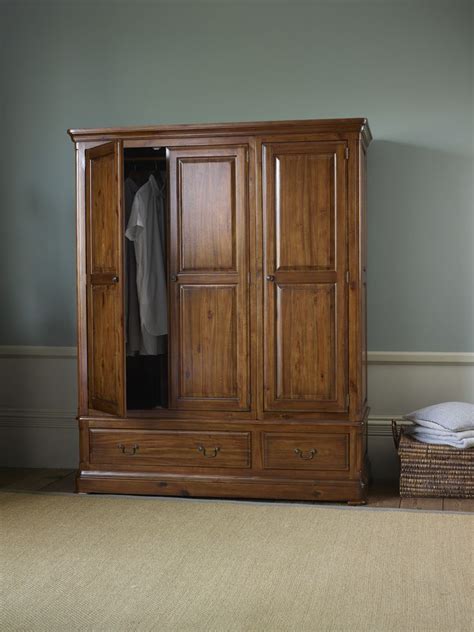 Our Classically Styled Cranbrook Dark Wood Triple Wardrobe Brings