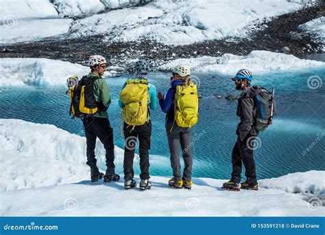 Four Ice Climbing Guides Looking Out on a Glacial Lake on the Matanuska ...