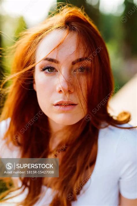 Portrait Of Young Redheaded Woman Superstock