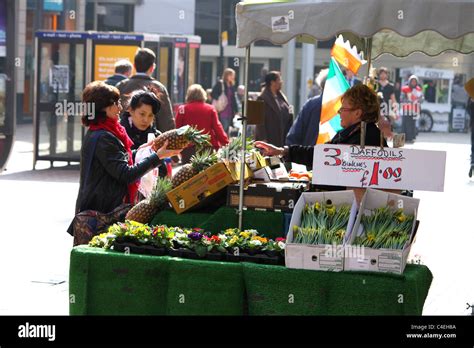 A Fruit Vegetable And Flower Market Stall Advertising Daffodils Stock