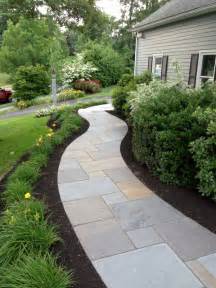 Curving Bluestone Walkway With Radius Granite Steps