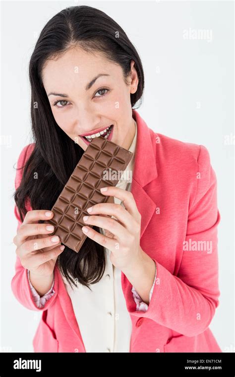 Smiling Brunette Biting Bar Of Chocolate Stock Photo Alamy