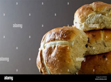 Stack Of Hot Cross Buns Against Plain Background Stock Photo Alamy