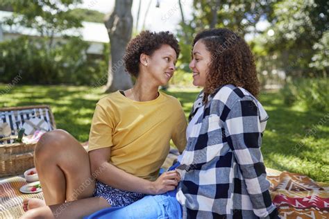 Happy Lesbian Couple On Picnic Blanket Stock Image F037 8987