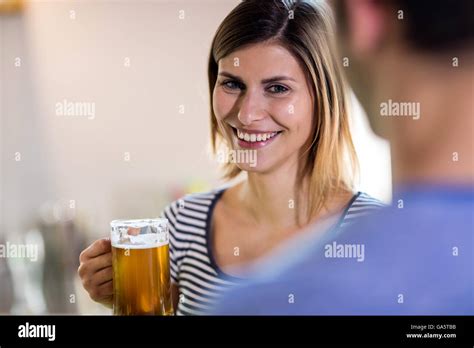 Smiling Young Woman Holding Beer Mug Stock Photo Alamy