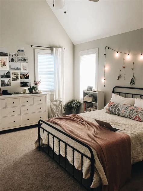 A Bed Room With A Neatly Made Bed And Lots Of Lights