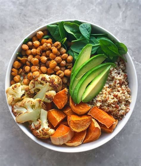 Filling And Satisfying Nourish Bowl💚 Filled With Roasted Curried Chickpeas Baked Sweet Potato