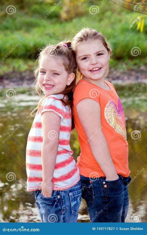 Sisters Pose Back To Back Stock Image Image Of Jeans 159717827