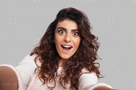 Funny Selfie Self Portrait Of Playful Young Smiling Woman Making A