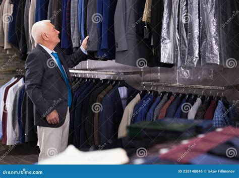Mature Customer Looking Jacket In Men Clothes Store Stock Photo Image
