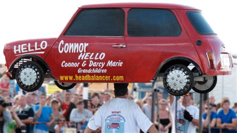 The Story Of The Man Who Broke Records For Balancing A Car On His Head