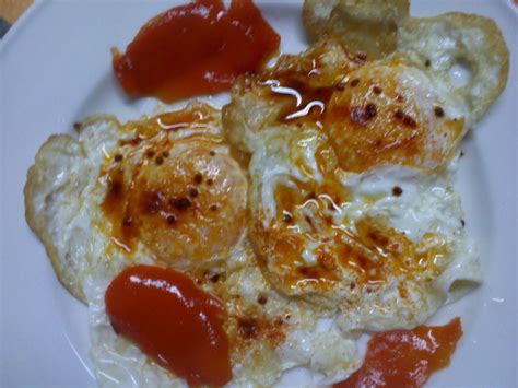 Huevos fritos con pimiento y pimentón Receta Petitchef