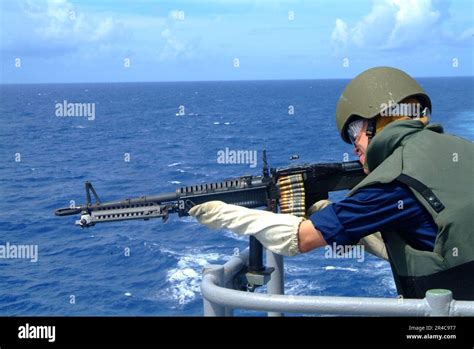 Us Navy Midshipman 2nd Class Gets Small Arms Training On The Bridgewing Of The Amphibious Dock