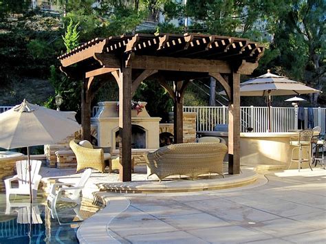 Poolside Timber Frame Pergola With Outdoor Fireplace Traditional