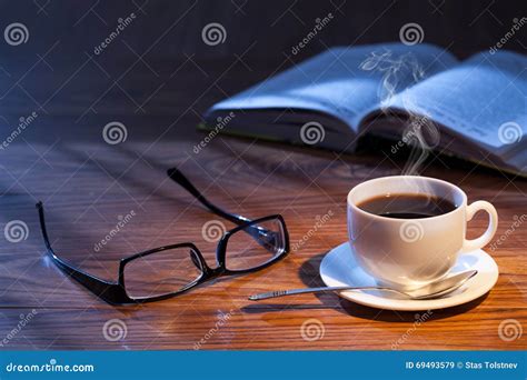 Cup Of Coffee Open Book And Glasses On A Desk Stock Image Image Of Book Glasses 69493579