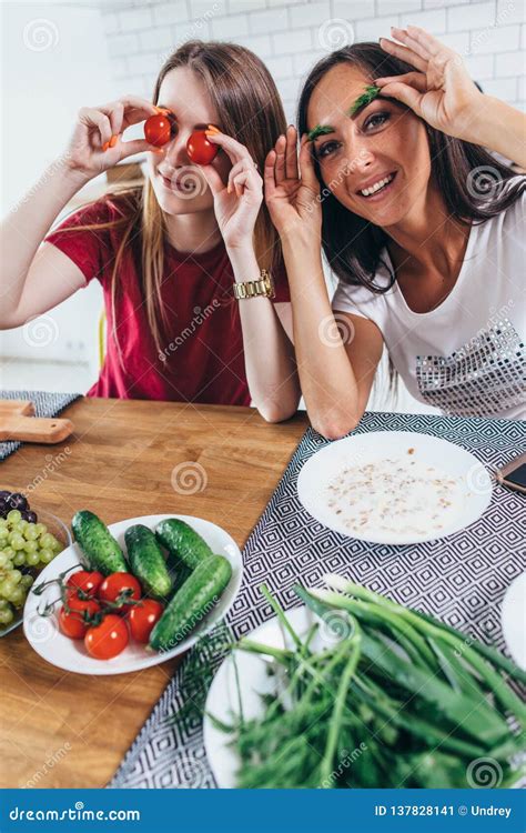 Girls Fooling Around In The Kitchen Playing With Vegetables Stock Image Image Of Nutrition