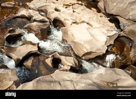 Clear Water Going Through The Rocks At Vale Da Lua Chapada Dos