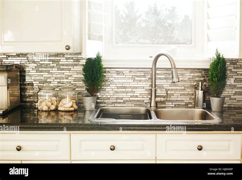 Countertop and sink in modern kitchen Stock Photo - Alamy