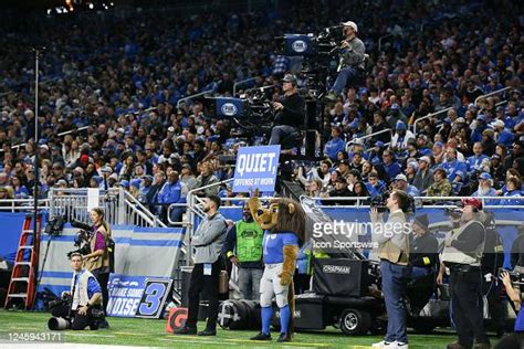 Detroit Lions mascot Roary holds up a sign that says Quite, Offense ...