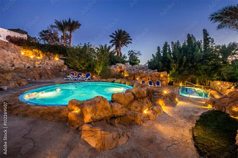 Evening view for luxury swimming pool in night illumination Stock Photo ...