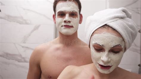 Happy Positive Young Couple Man And Woman Having Fun While Standing In A Bathroom After Shower