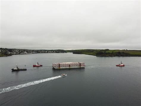 306ft Barge To Be Used To House Up To 500 Asylum Seekers Is Towed Into