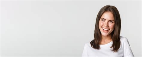 Premium Photo Closeup Of Joyful Beautiful Brunette Girl Looking Upper Left Corner And Laughing