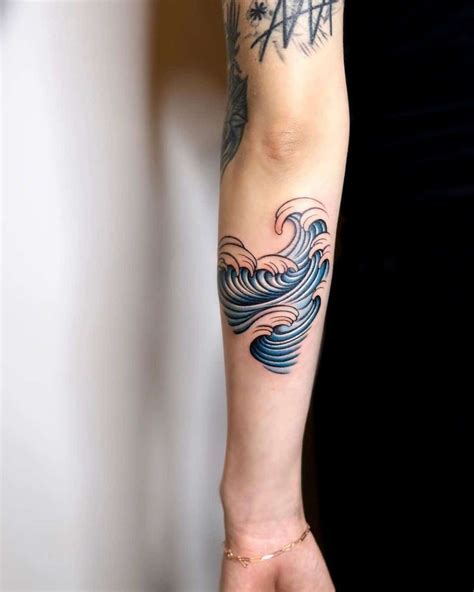 Arm Wave Tattoo Blue Design | Wave tattoo design, Tribal wave tattoos ...