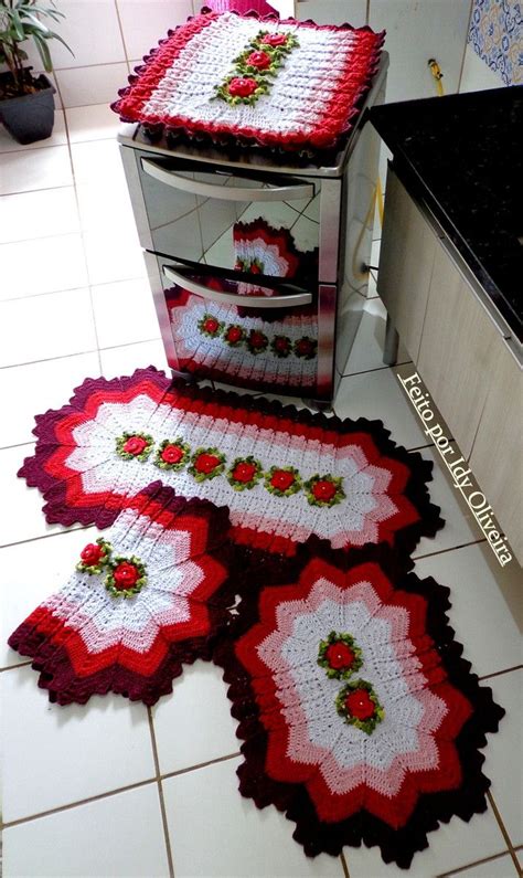 Three Red And White Crocheted Rugs Sitting On Top Of A Kitchen Counter