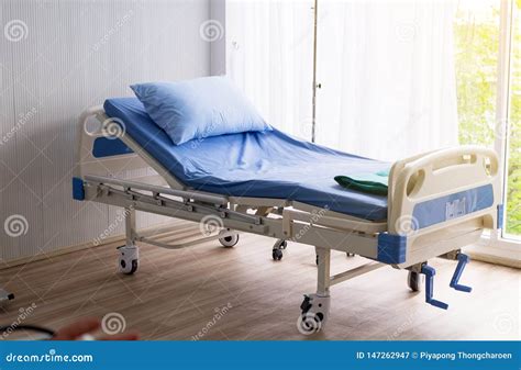 Empty Sick Bed At Hospital Room For Supporting Patient Stock Image