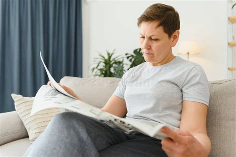 Woman Reading Newspaper At Home Stock Image Image Of Couch Business 246290599