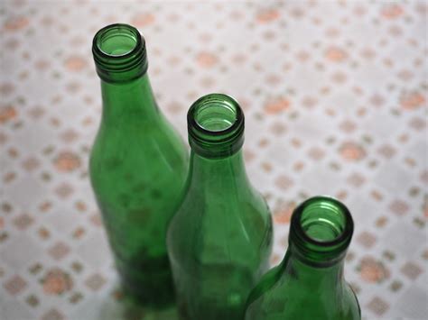 Premium Photo Three Green Bottles