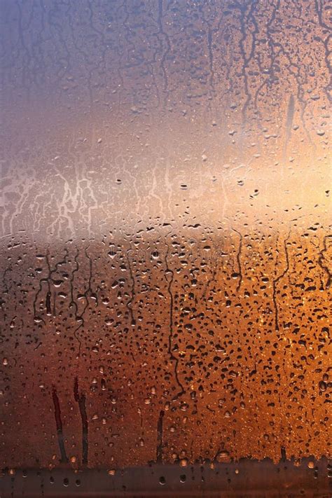 Vertical Natural Background With Water Drops On A Window With Sun Rays