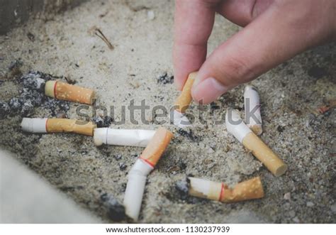 Hand Putting Out Cigarettecigarette Butt Stock Photo