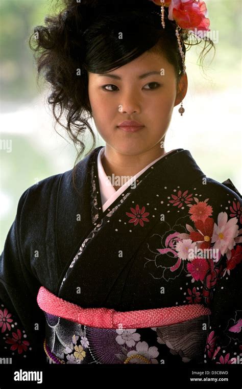 Beautiful 19 Year Old Japanese Girl Wearing Traditional Furisode Long Sleeve Kimono With Spring