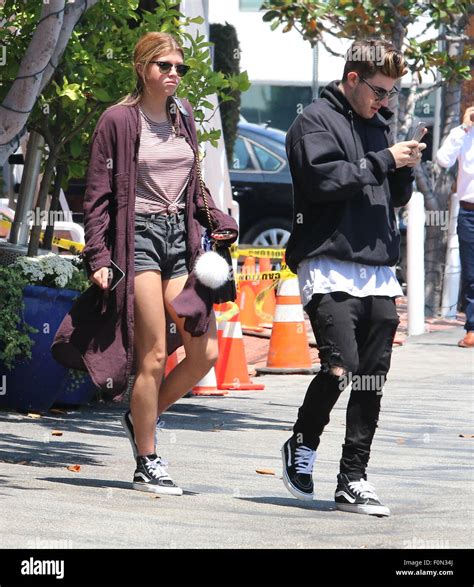 Sofia Richie walks behind her boyfriend, Jake Andrews, while shopping at Fred Segal Featuring ...