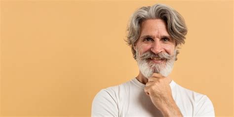 Free Photo Portrait Of Old Man Looking Away With Copy Space