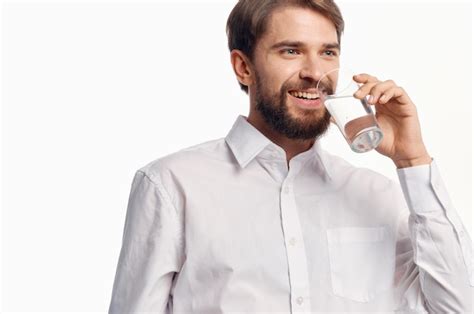 Premium Photo Young Man Drinking Glasses Against White Background