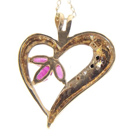 Lot 10k Gold And Ruby Heart Pendant Necklace