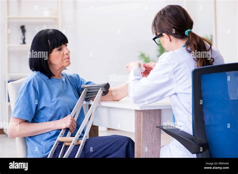 Doctor Examining Old Mature Woman After Incident Stock Photo Alamy