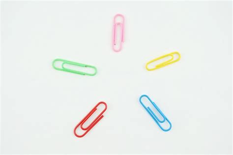 Premium Photo Multi Colored Paper Clips Arranged Over White Background