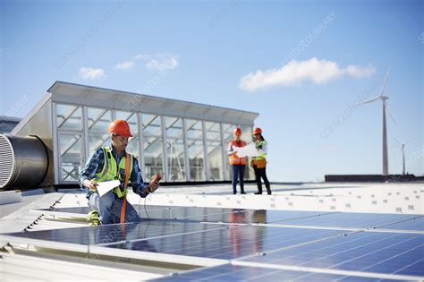 Engineer Testing Solar Panels At Sunny Power Plant Stock Image F022