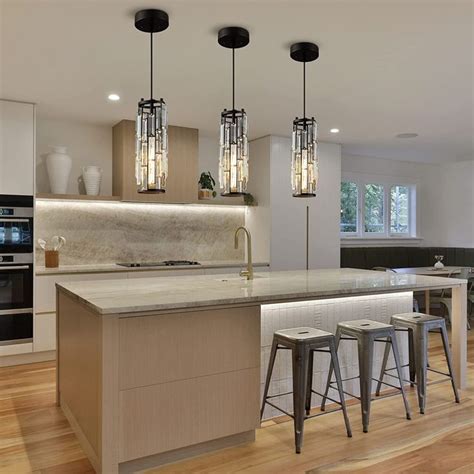 a kitchen with an island and bar stools